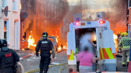 Police fire water cannon on second night of anti-immigrant protests in Northern Ireland