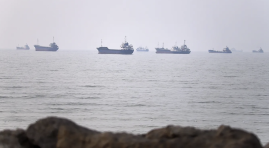 Tanker attacked in Strait of Hormuz as US strikes Iran for tenth consecutive night