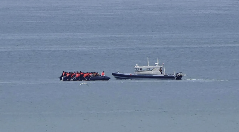 Record 230 migrants cross English Channel in single small boat, French officials say Record 230 migrants cross English Channel in single small boat, French officials say