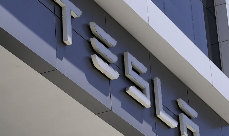 Tesla's profit drops as it explores a possible merger with Musk's other public company, SpaceX Tesla's profit drops as it explores a possible merger with Musk's other public company, SpaceX