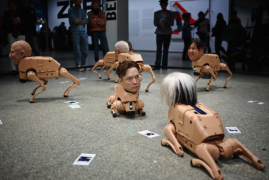 Robot dogs with Musk and Zuckerberg heads roam around Berlin museum in Beeple’s new exhibit