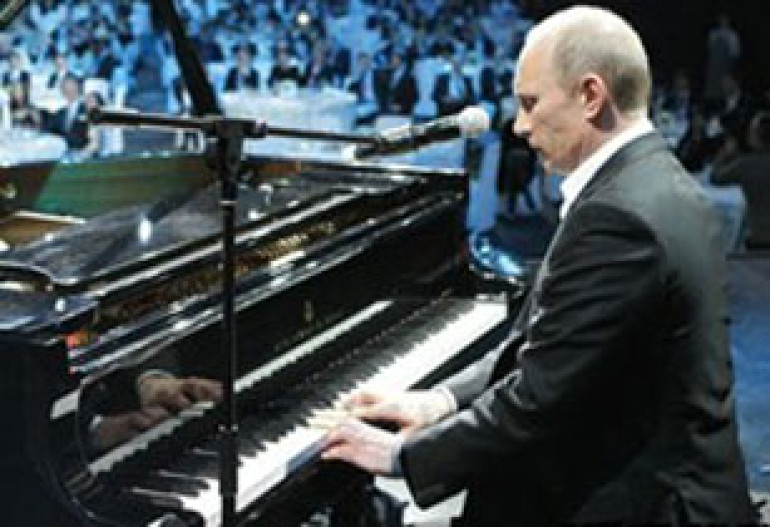 Russia's Putin sings, plays piano at charity event