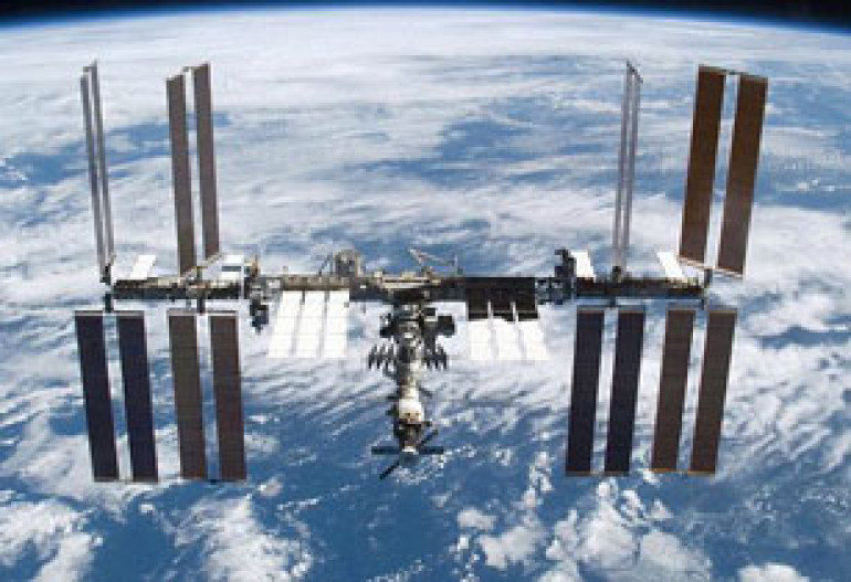 International Space Station captured in amazing image next to Moon