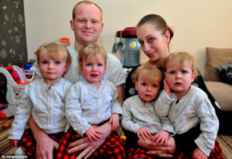 Woman who was told she was probably infertile becomes Britain's youngest mother of identical natural quadruplets