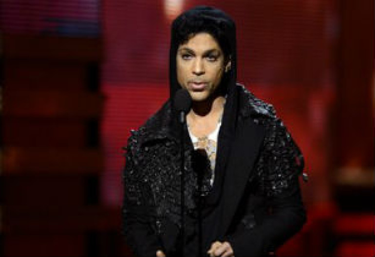 Pop star prince re-signs with slave label