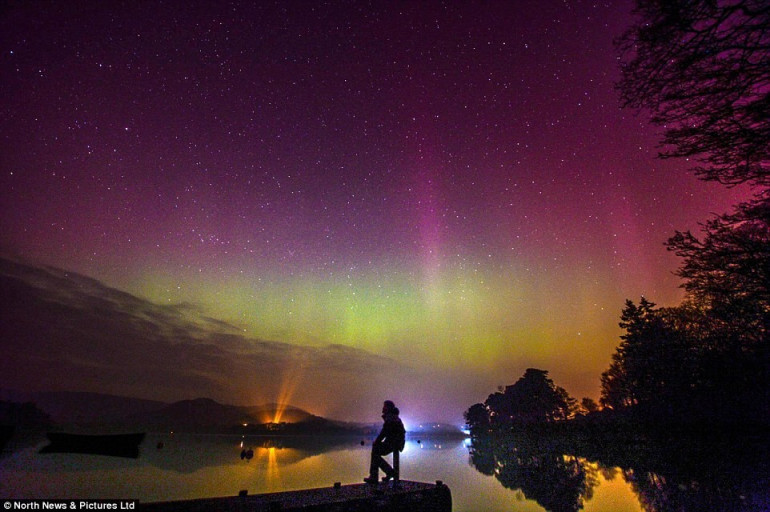 Sensational light shows wow crowds across the globe as a 'severe' solar storm strikes Earth