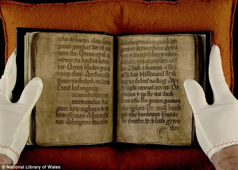 Book of Ghosts: Eerie faces and messages discovered in ancient medieval manuscript of King Arthur and Merlin
