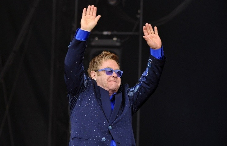 Putin flattered after Elton John calls him