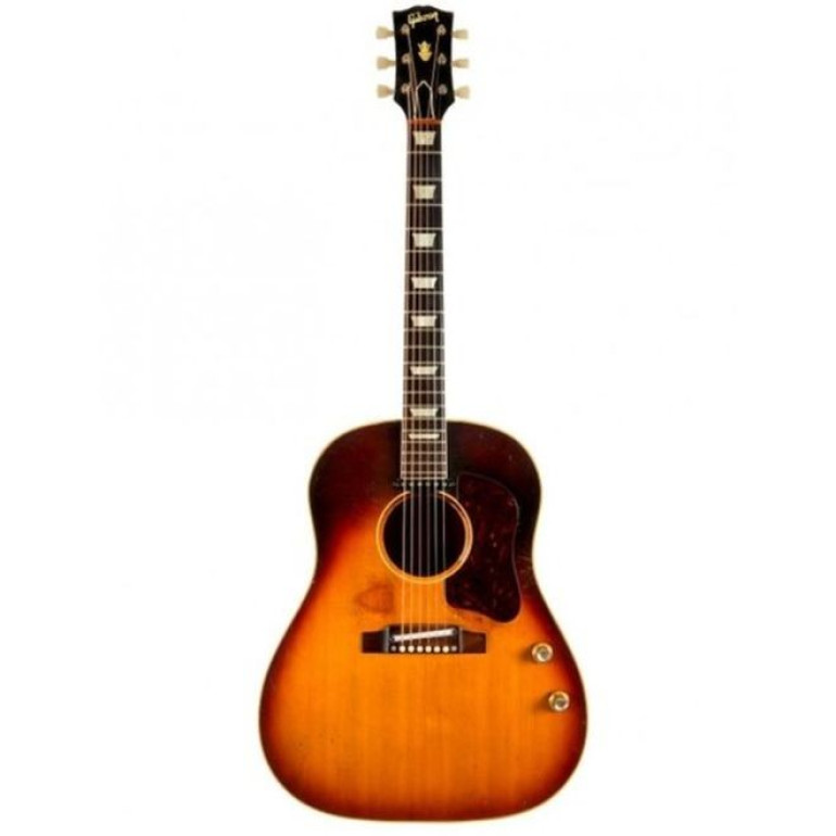 John Lennon's acoustic guitar sells at auction for $2.4m