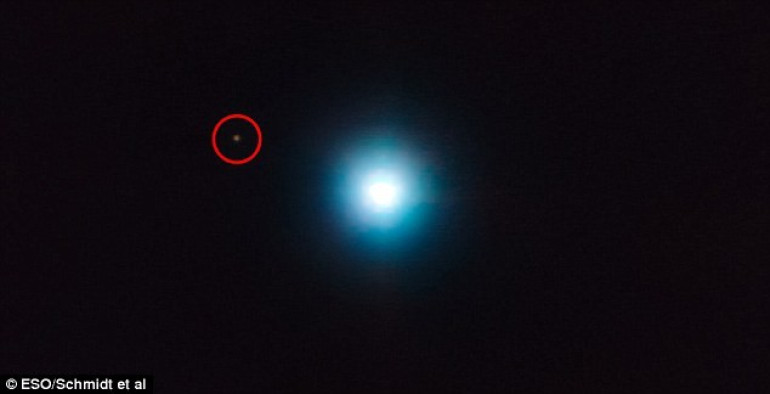 Lonely planet clinging onto its star: Incredible image of alien world 1,200 light years away reveals an unusually large orbit