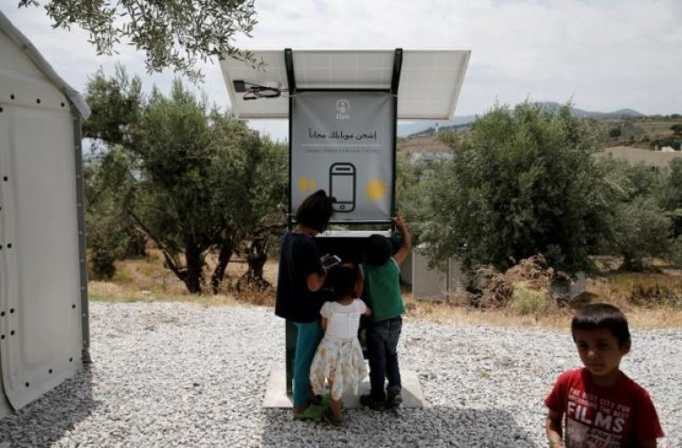 Sun-powered phone charger gives migrants free electricity in Greece