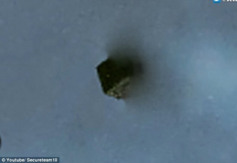 UFO hunters claim to have spotted strange cube falling from a 'black hole portal' over White Sands military base