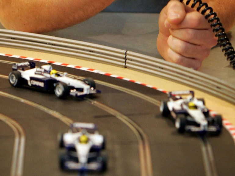 Electric cars are charged while moving at more than 60mph on new Scalextric-style track