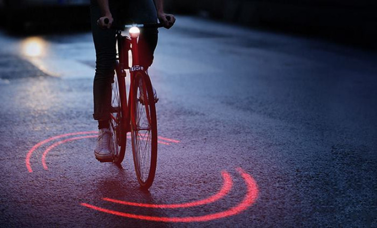 French manufactures makes bike lighting system protecting cyclists from traffic inside ring of red light
 