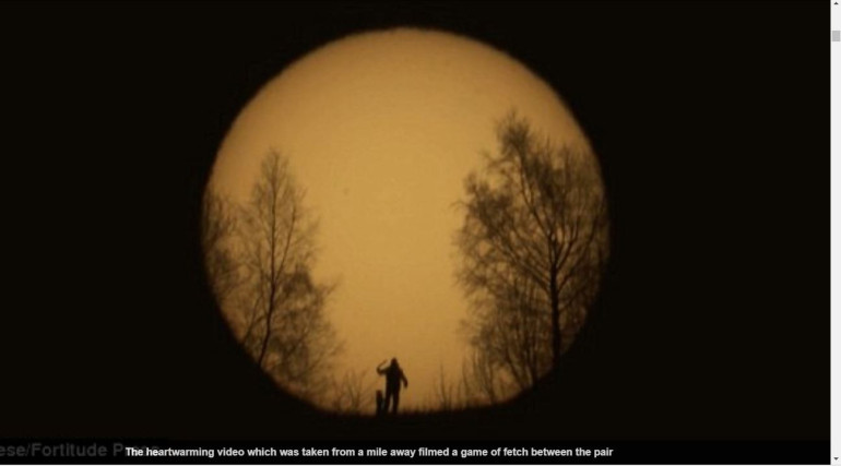 Stunning telescopic footage taken from over mile away captures the silhouettes of photographer and dog playing fetch at sunrise