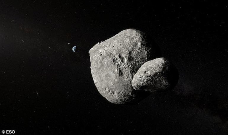 Fascinating image captured by telescope reveals mile-wide asteroid with its own mini moon as it passes the Earth at 43,000 mph