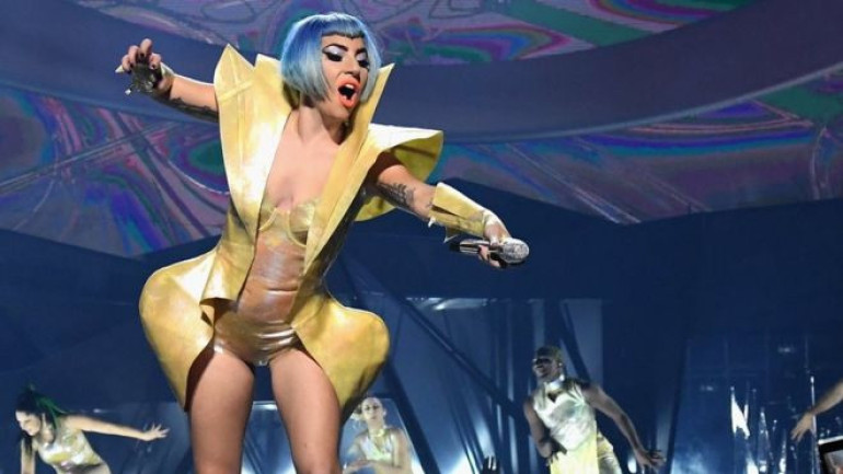 Lady Gaga plummets off stage in a fan's arms during Vegas show