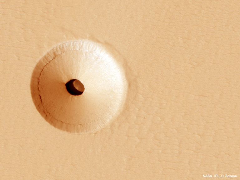 NASA photo reveals mysterious hole in Mars