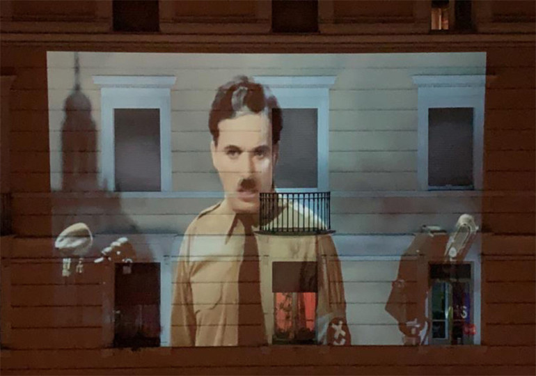 Isolated Italians project cassic film clipso onto Rome buildings to lift beleaguered city’s spirits