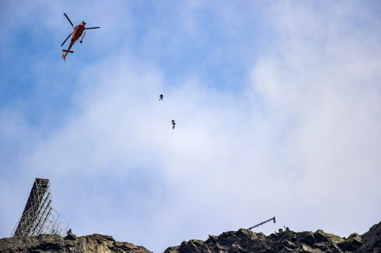 Tom Cruise pulls off death-defying motorbike stunt as he flies through the air filming Mission Impossible