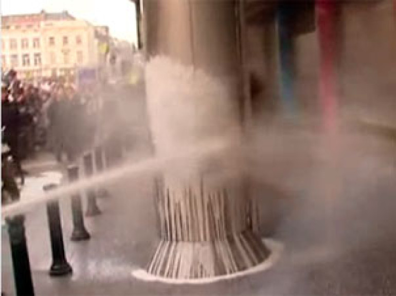 EU dairy farmers spray parliament with milk